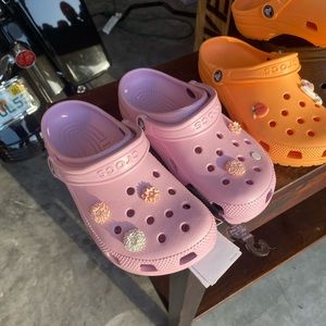Pink crocs with flowers